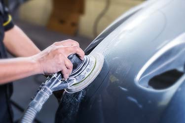 Close up of car paint being polished