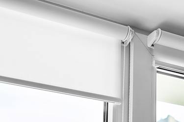 Close up of quality Roman blinds roller fixtures on modern window