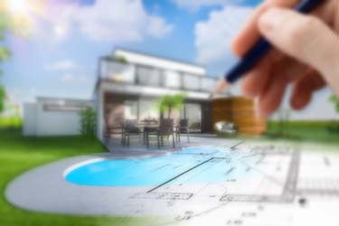 3D rendered home with pool construction plans superimposed over the top and hand holding pencil ready to add to plan