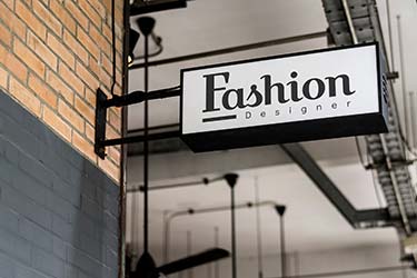 Stylish, 3D street sign for high-end designer fashion shop