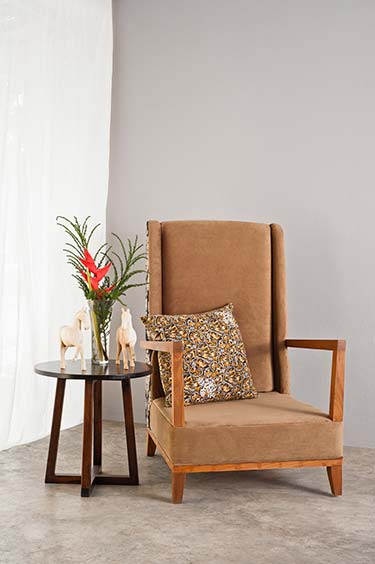 Unique statement chair upholstered in rich brown suede material, backed with fashionable patterned print
